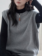 Dark Gray Crew-neck Half-zip Knit Vest Layered Over A Gray College-style Sweater Vest