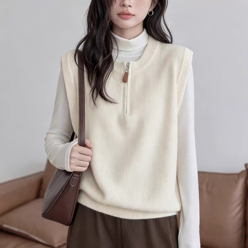 Dark Gray Crew-neck Half-zip Knit Vest Layered Over A Gray College-style Sweater Vest