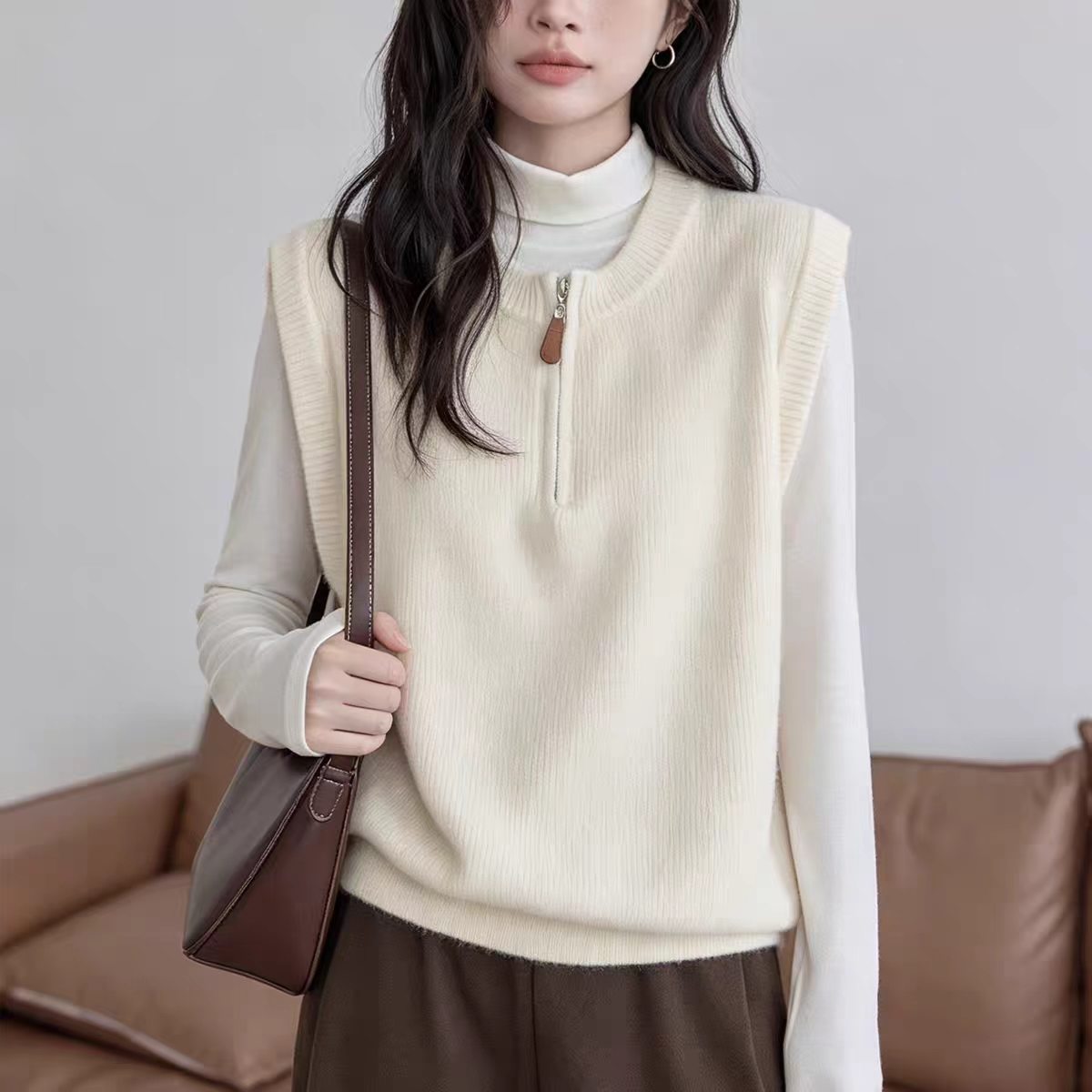 Dark Gray Crew-neck Half-zip Knit Vest Layered Over A Gray College-style Sweater Vest